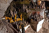 Luang Prabang, Laos - The Pak Ou Caves, the lower cave called Tham Ting. The caves, a Buddhist pilgrimage site, are a repository of old Buddha statues.